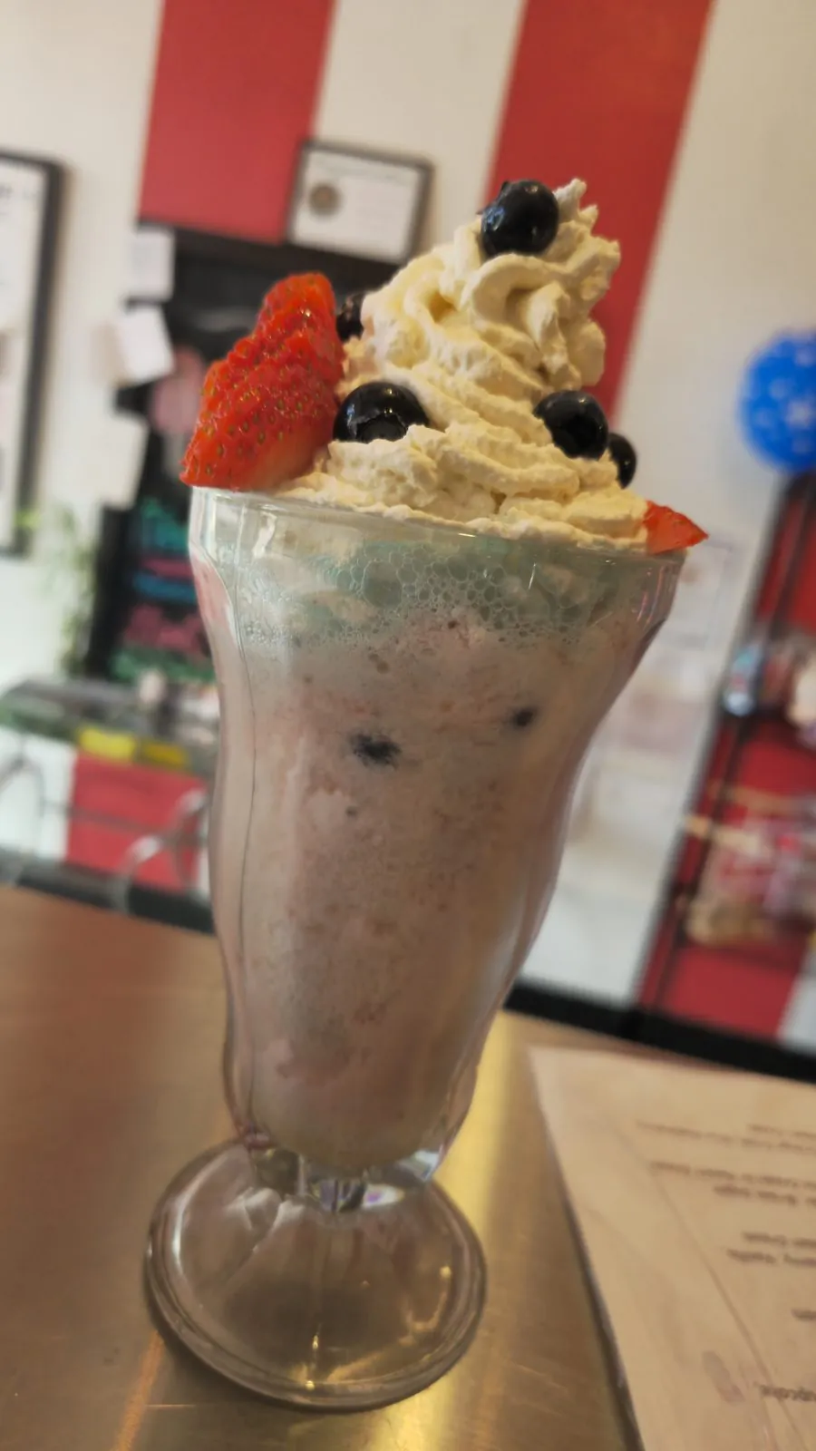 Freedom Shake — vanilla milkshake blended with strawberries and blueberries, topped with whipped cream and fresh berries