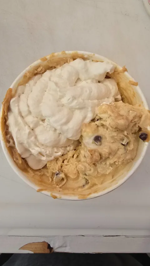 Cookie dough Avalanche bowl with whipped cream and peanut butter drizzle